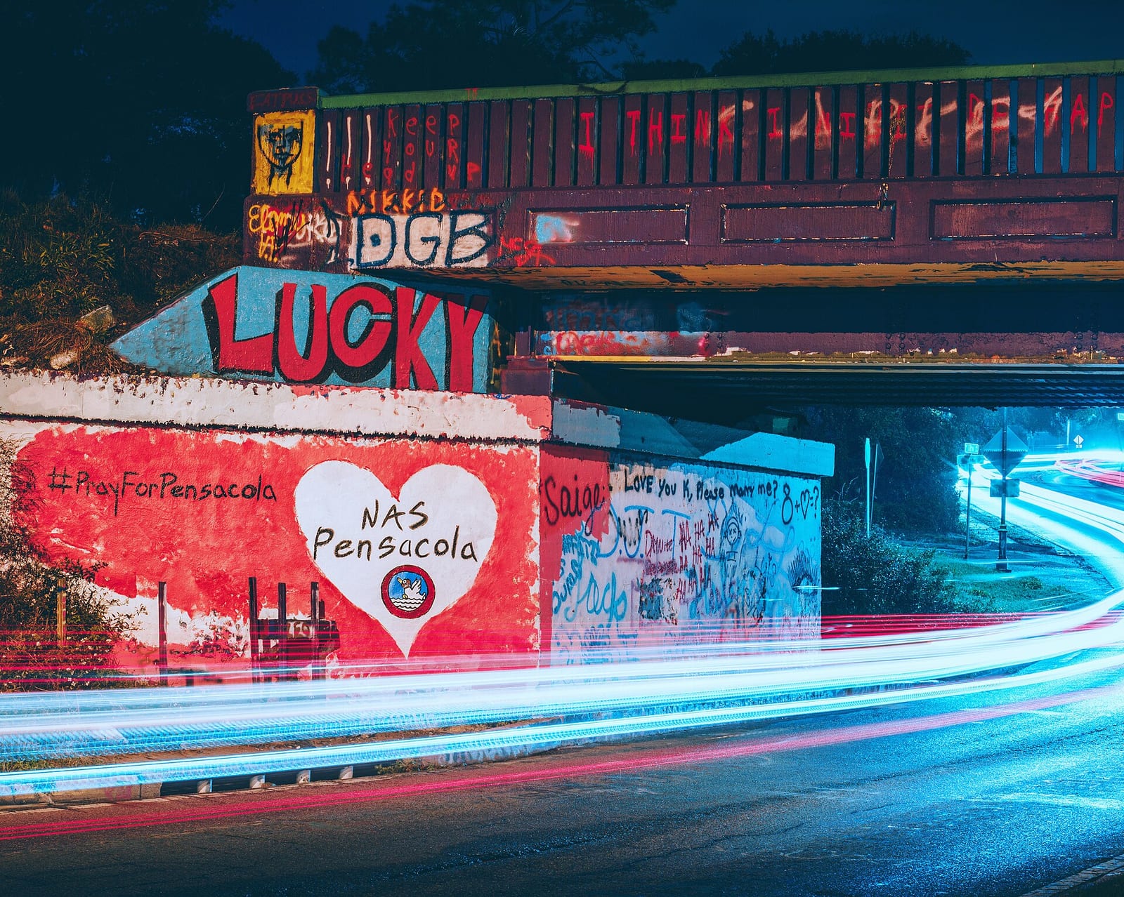 Pensacola's Graffiti Bridge at night with light trails