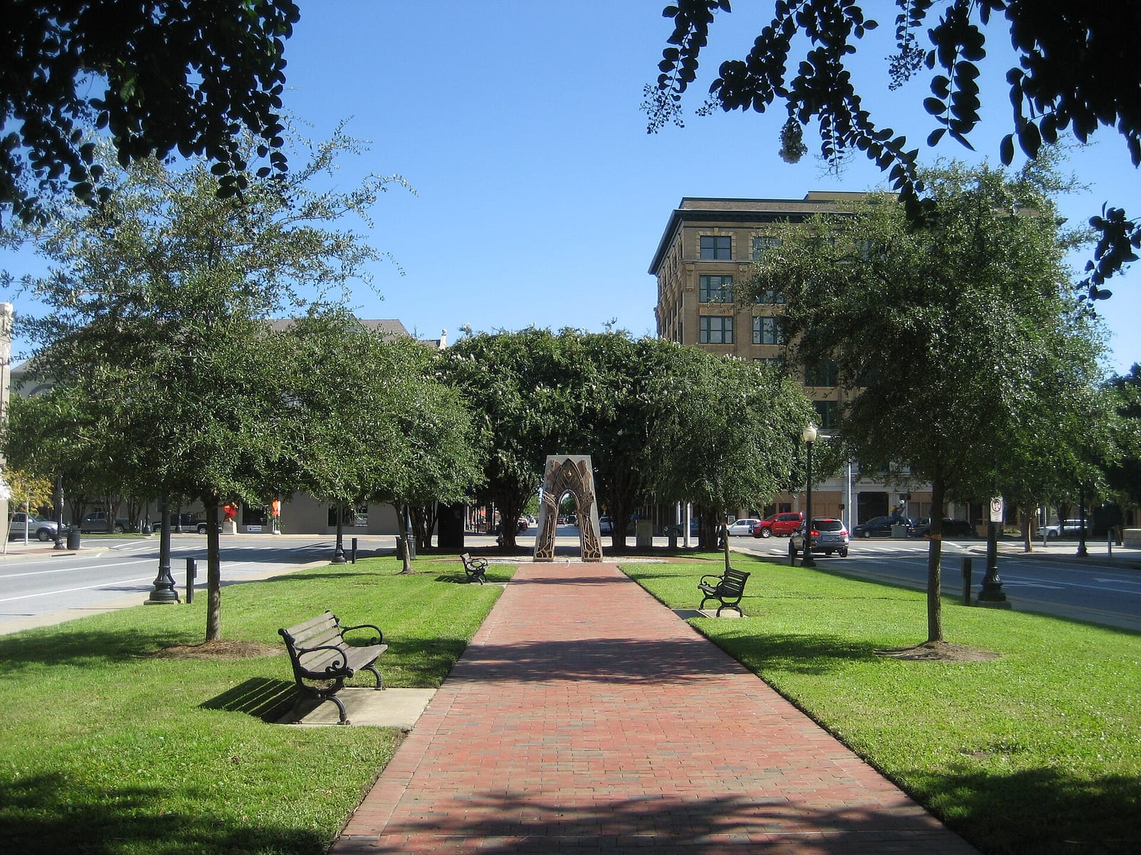 Tree-lined brick walkway along Palafox Street in downtown Pensacola